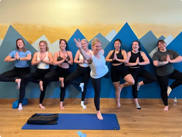 a group of women in a yoga class