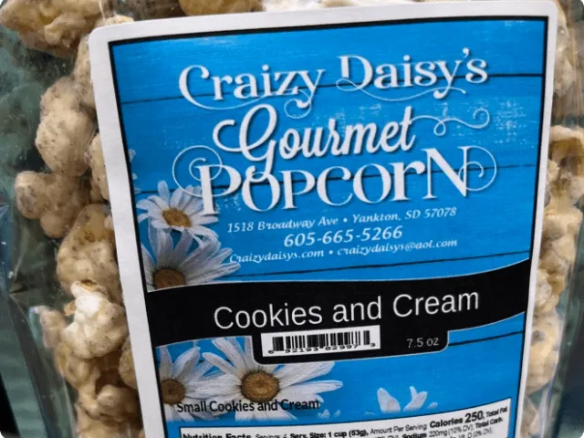 a bag of gourmet cookies and cream flavored popcorn