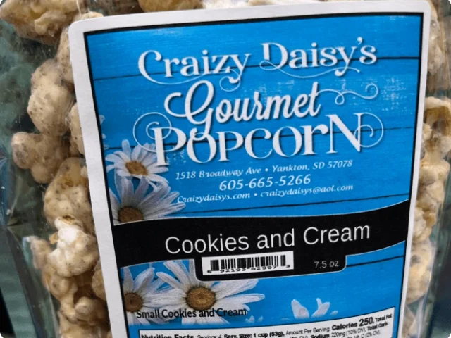 a bag of gourmet cookies and cream flavored popcorn