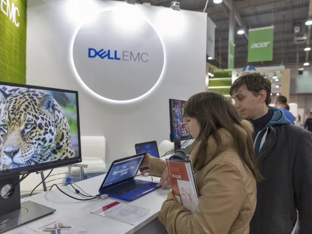 A man and woman browsing dell computer options