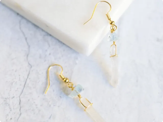 earrings on a stone background