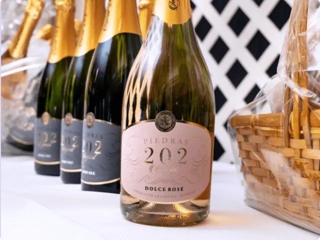 bottles of sparkling wine lined up in a row