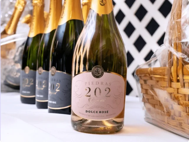 bottles of sparkling wine lined up in a row