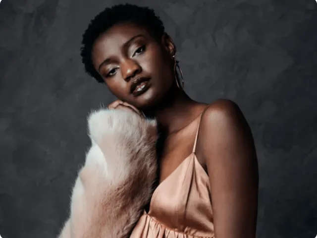 woman in a silk camisole and fur jacket