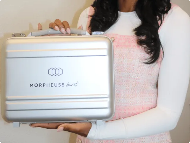 woman holding skincare product box