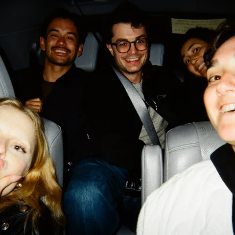 selfie in a car of a group of employees
