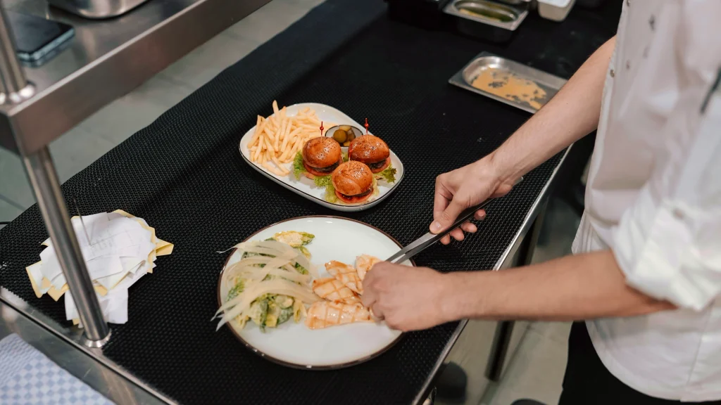 A chef plates a meal