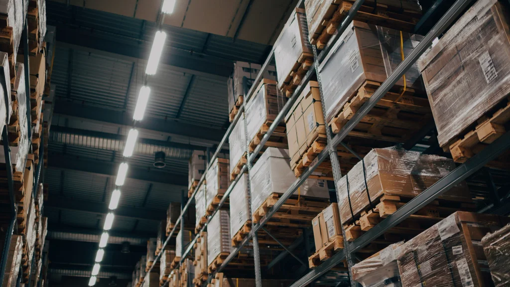 Upward angled view of containers stacked on racks