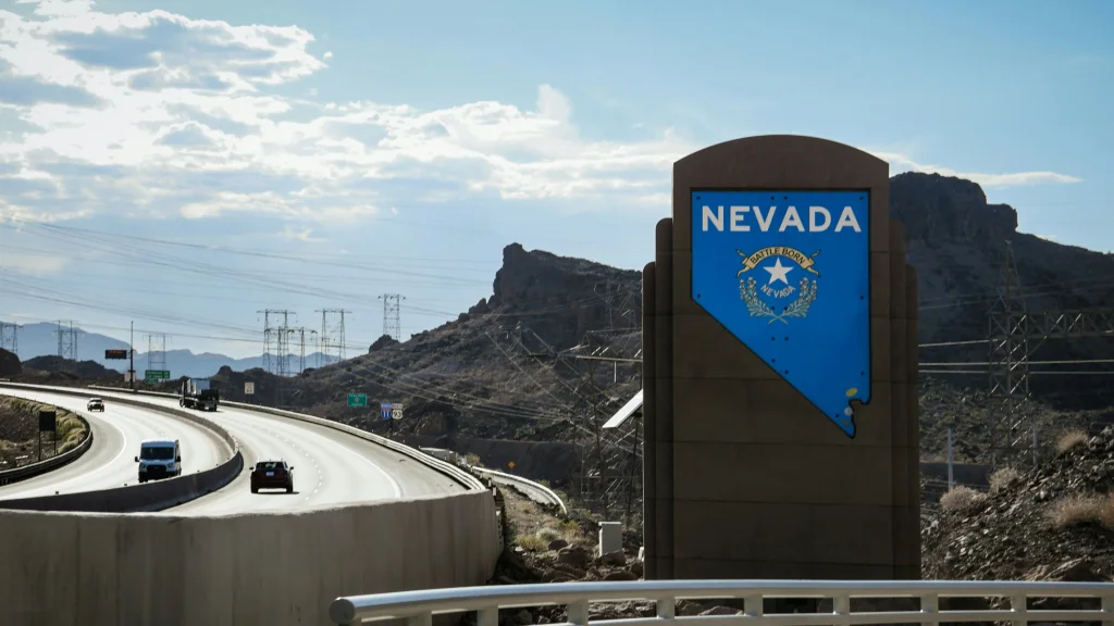 A highway with a state of Nevada sign