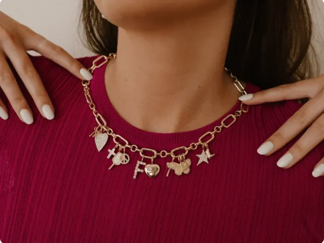 close-up of charm necklace on a woman