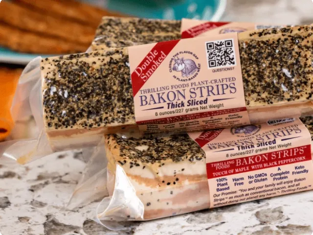 three individually wrapped plant-based bacon strips