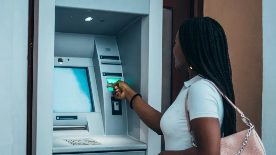 Woman uses an ATM