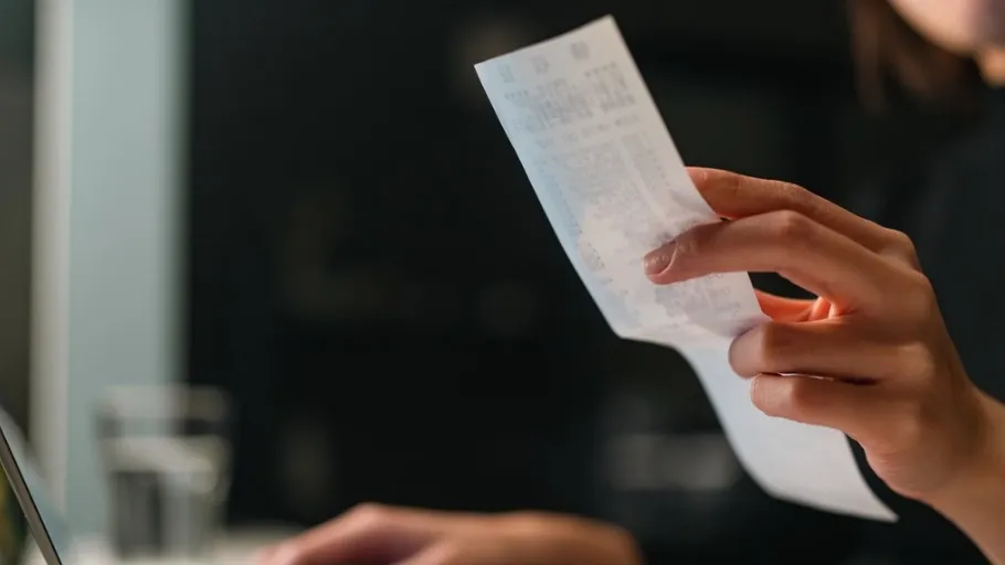 small business owner reviewing receipts while doing back taxes