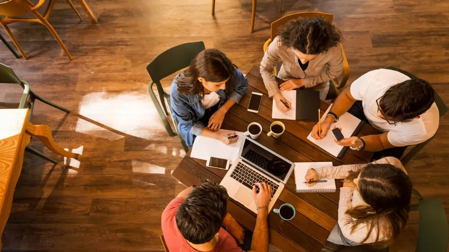 Small business team meets to discuss closing.