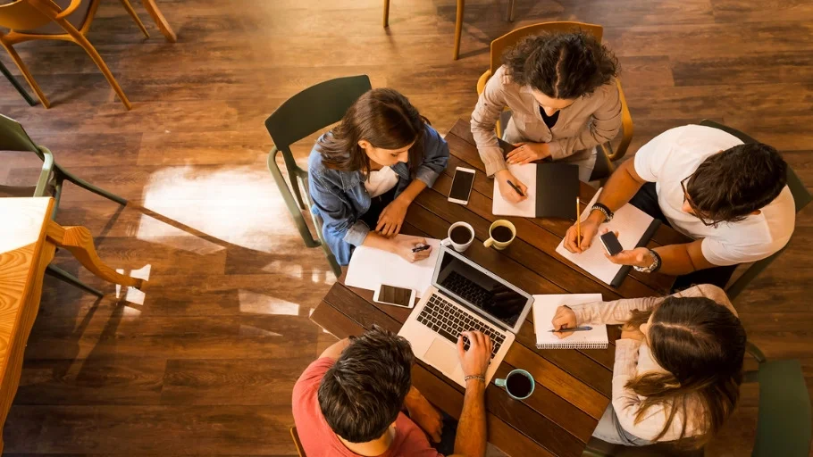 Small business team meets to discuss closing.