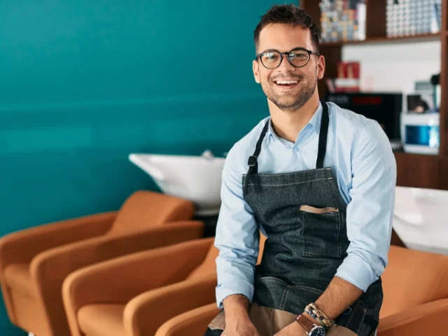 Small business owner manages customer reviews to increase sales.