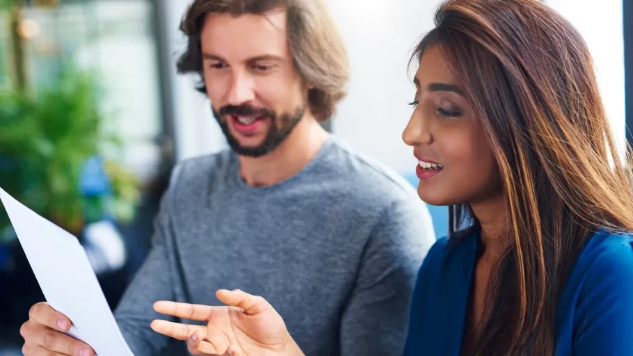 Small business owner uses a financial advisor before getting a business loan.