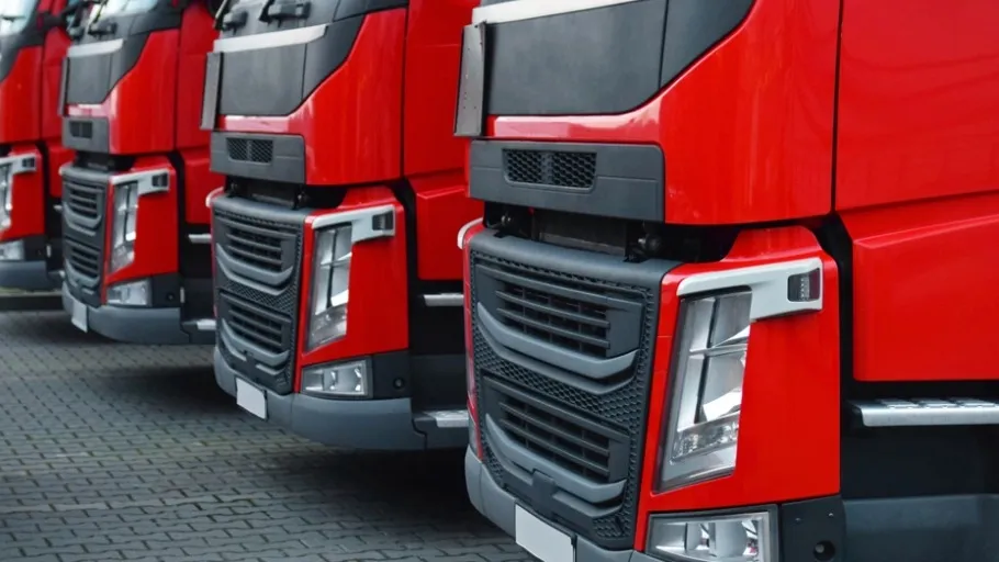 four red semi-trucks