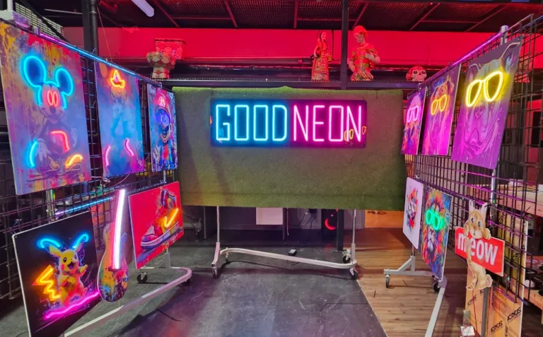 GoodNeon studio featuring colorful neon artwork, illuminated signs, and custom display pieces.