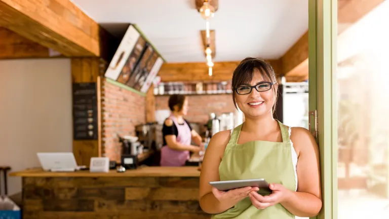 business owner on table to illustrate demystifying the business loan process