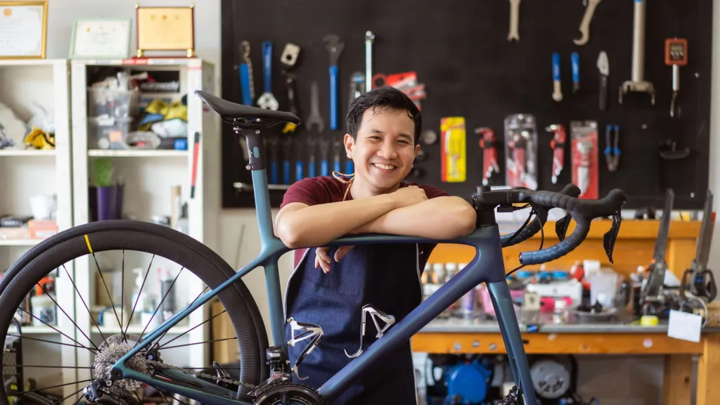 business owner in his bicycle shop meant to represent business owner with EIDL hardship modification