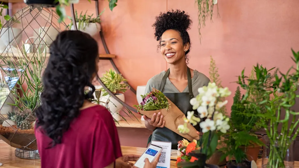 business woman accepting payment with Shop Pay