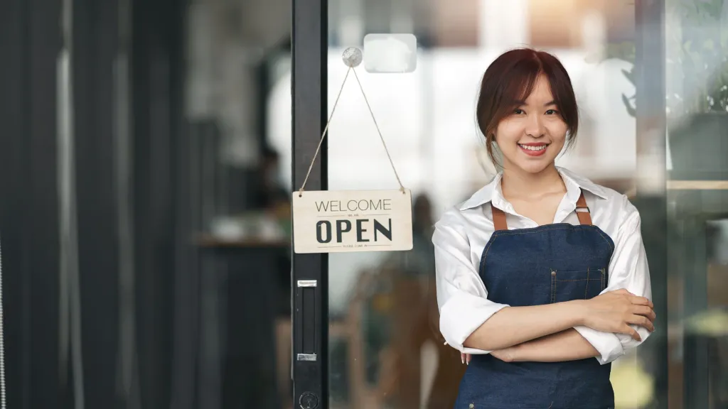 Woman starting a new business with startup business loan