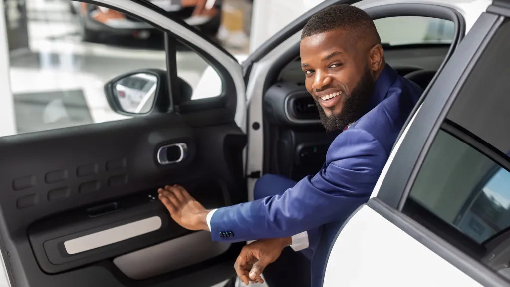 business owner in car with GM credit card reward