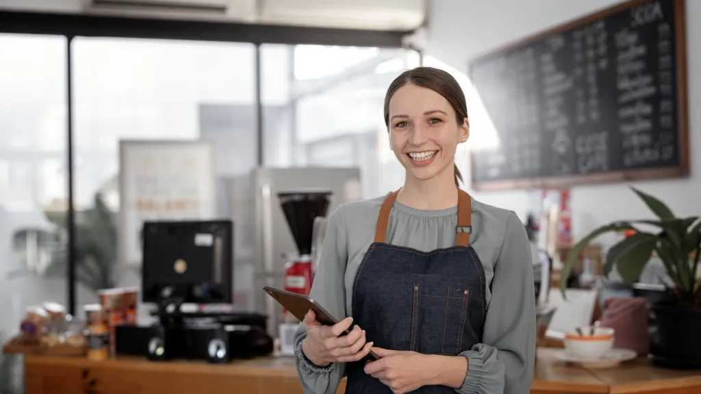 young business owner checking student loans