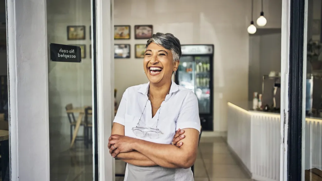 Female business owner smiling after getting tradelines fast