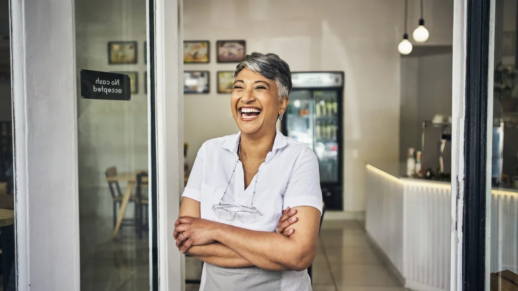 Female business owner smiling after getting tradelines fast