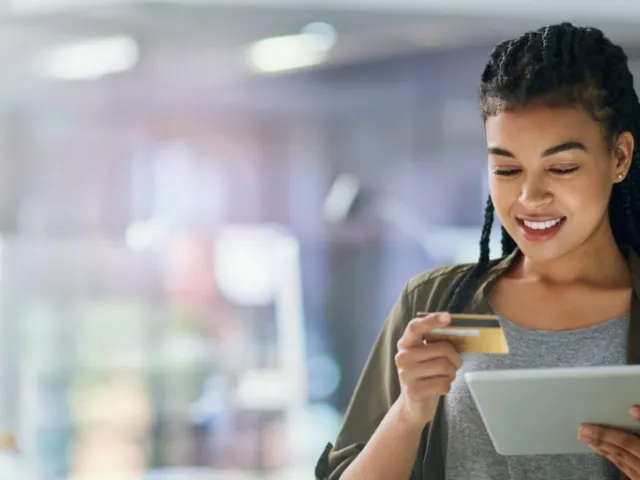 An employee using a credit card for expense management