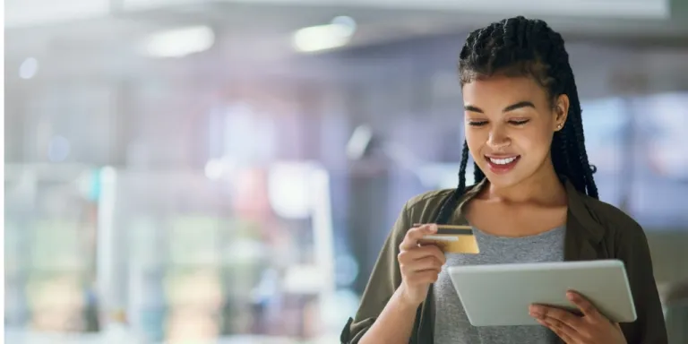 An employee using a credit card for expense management