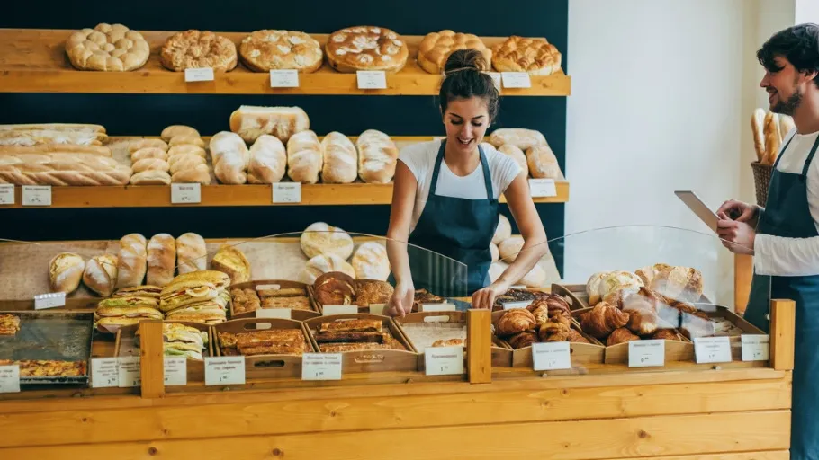 Small business owner manages payroll for employees.