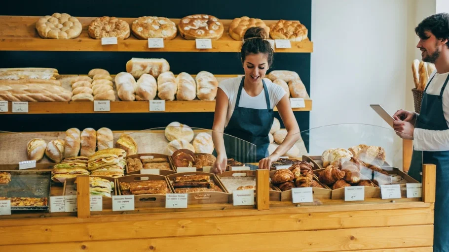 Small business owner manages payroll for employees.