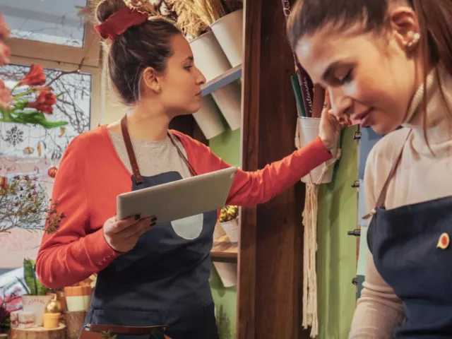 Small business owner uses payroll service solutions