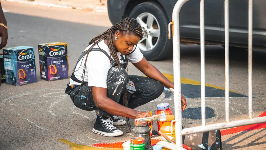 street artist painting on street