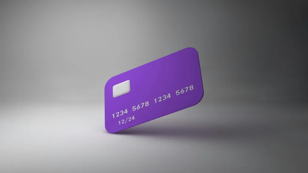 purple credit card against gray background