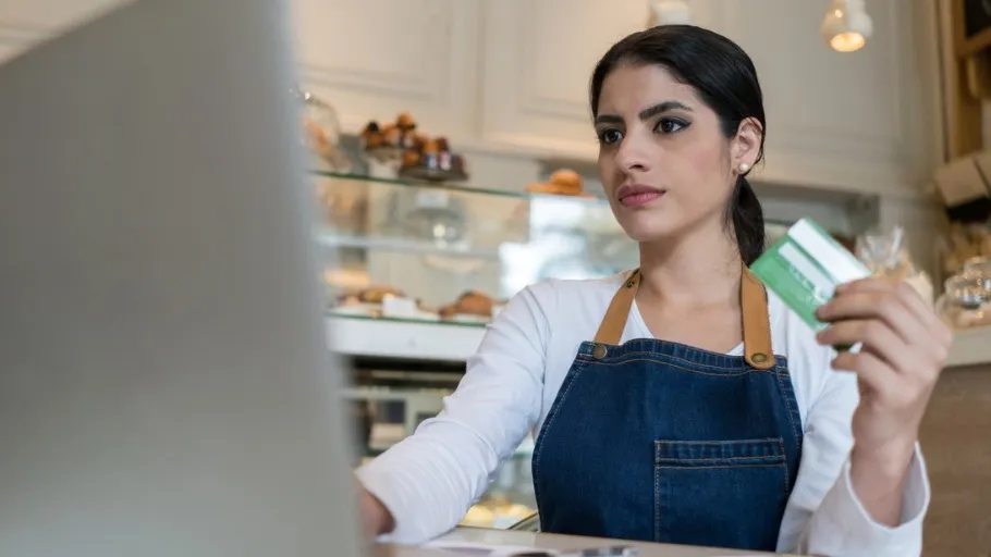 Catering business owner using a credit card