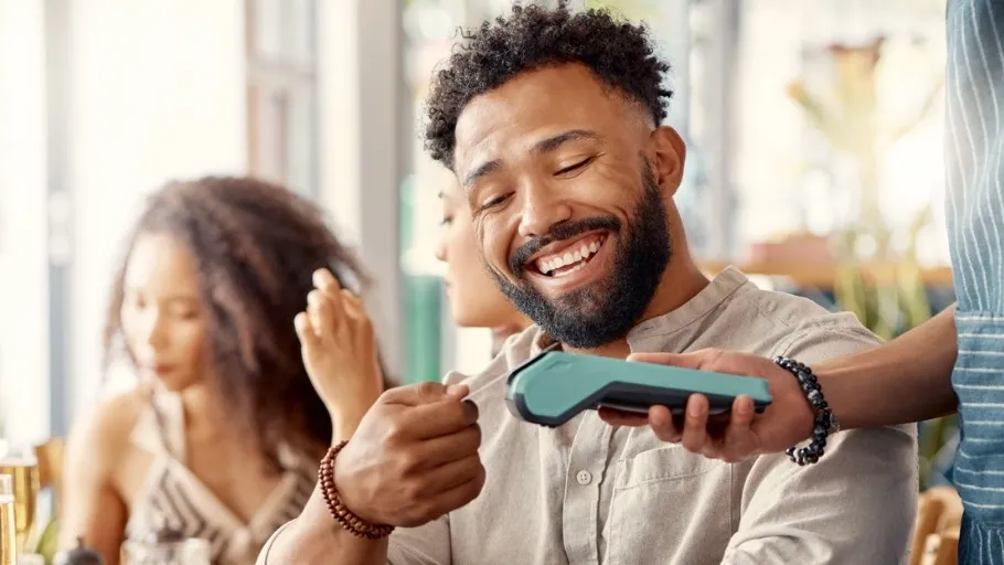 Customer paying with a credit card at a restaurant