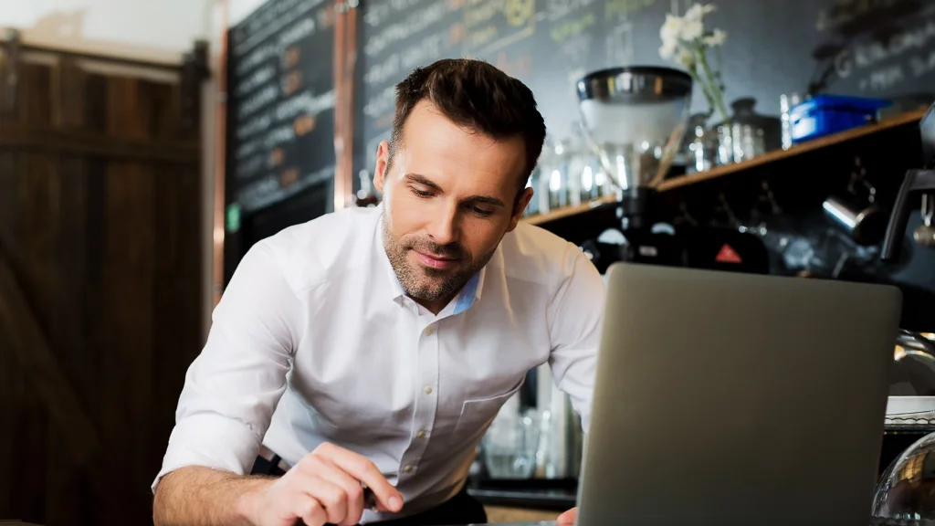 Small business owner examines their business's financial health.