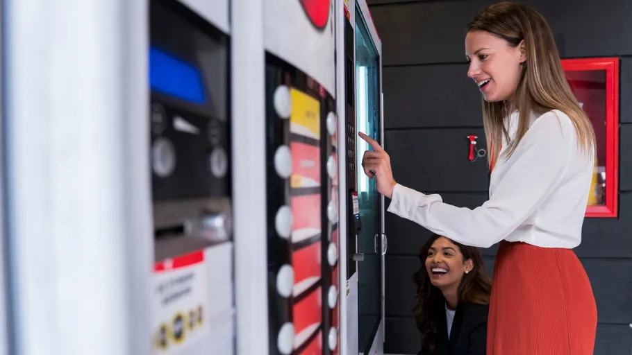 Vending machine business owner examines machines.
