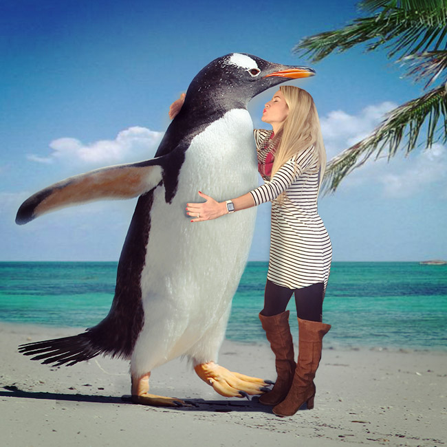 Catalina hugging a giant penguin
