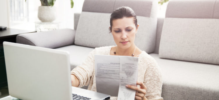 Woman in her 30s filling out tax information online