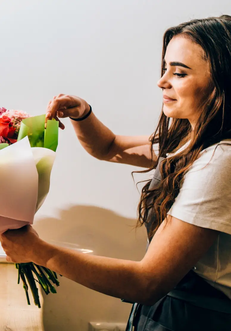 Florist Owner arranging a bouquet