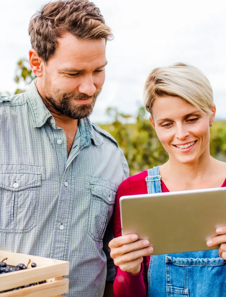 Gardners looking at tablet